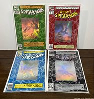 Four Marvel Spider-Man comics from the 1992 30th Anniversary set showing hologram covers in protective sleeves.