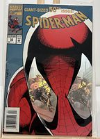 Front cover showing Spider-Man with holographic spider eyes reflecting heroic scenes.