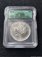 Encapsulated 2008 Canadian Maple Leaf $5 silver coin with ICG MS69 grading showing front label with coin details and grade information.