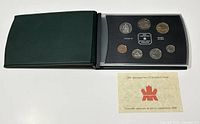 Image showing the display set holder with the 7 Canadian coins and an informational card below.