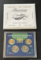 Photo of American Coin Treasures envelope and coin set in plastic case showing all four coins and label.