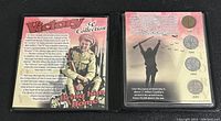 Front of sealed Victory 5 cent coin collection showing historical text, wartime soldier illustration, and set title