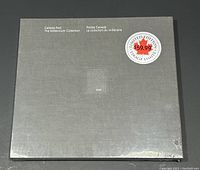 Front view of the gray textured slipcase with silver lettering and a $59.99 limited edition price sticker.