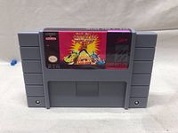 Front view of Dragon Ball Z Super Nintendo cartridge with label graphics and licensing info