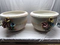 Pair of large off-white vintage vases with floral detail and gold trim