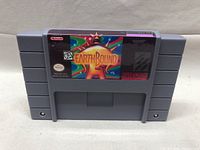 Front view of cartridge showing EarthBound label and artwork