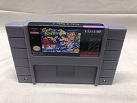 Front label of the 'Pocky & Rocky 2' Super Nintendo game cartridge showing colorful title and artwork.