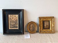 Group shot of three framed artworks side by side