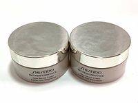Two unopened jars of Shiseido Bio-Performance Glow Revival Cream with closed silver lids, placed side by side.