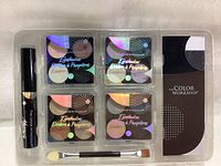 Top view of set showing four eyeshadow palettes, mascara, brush, and packaging