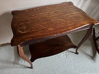 Overhead angled view showing the quarter sawn oak lamp table with beveled edges and water mark stain on corner.
