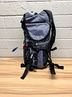Front view of the closed hydration pack backpack showing its compact size, shoulder straps, and Outdoor Products branding.