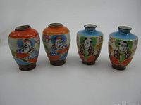 Four small hand-painted Asian mini vases with colorful designs showing the front sides with male figures.
