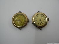 Two gold filled vintage wristwatches side by side, showing overall condition and size relative to each other.