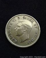 Obverse side of the 1939 Canadian quarter showing King George VI profile and inscription.
