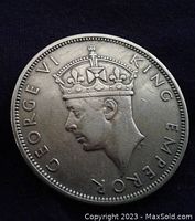 Obverse side showing King George VI profile with crown and inscription.
