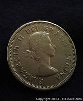 Obverse of the 1963 Canadian quarter showing Queen Elizabeth II with the inscription.