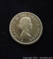 Obverse side of the 1964 Canadian quarter showing Queen Elizabeth II profile and inscriptions.