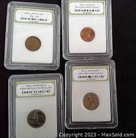 Four graded US coins in protective slabs including Early Lincoln Cent, 1972-P Lincoln Cent, 2005-D Ocean Jefferson Nickel, and 2011-P Jefferson Nickel.