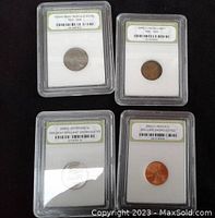 Four graded USA coins encapsulated by International Numismatic Bureau: 1903-S Buffalo Nickel VF35, Early Lincoln Cent, 2000-D Lincoln Cent BU, 2004-D Jefferson Nickel BU.