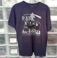 Front view of navy T-shirt displaying Pink Floyd Earls Court 1973 graphic.