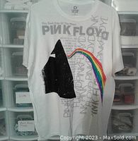 Front of the white Pink Floyd T-shirt showing the black prism, rainbow light beam and Pink Floyd with album text design.