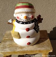 Front view of the large ceramic snowman cookie jar showing details of colors and texture.