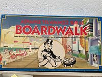 Front of the board game box showing the artwork and title in both English and French.