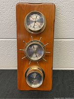 Full view of the Sunbeam weather station panel with three mounted instruments (thermometer, barometer, hygrometer/clock).
