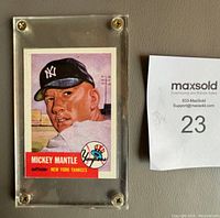 Front of Mickey Mantle 1953 Topps Archives #82 baseball card in clear screwdown protective holder next to lot number paper