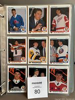 Binder pages showing multiple hockey cards including players Dave Maloney, Dain Nelson, Ralph Klassen, Mike Richter, Jaromir Jagr's rookie card, and others.