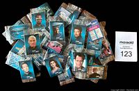 Pile of sealed cello packs with character cards visible through the packaging depicting Star Trek The Next Generation characters.