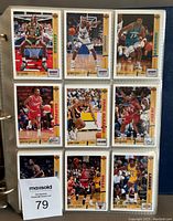 Page of 9 Upper Deck basketball cards featuring players from teams including Boston Celtics, Seattle Supersonics, Cleveland Cavaliers, Phoenix Suns, Chicago Bulls, and Indiana Pacers. Cards are in plastic binder sleeves.