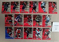 Lot of 16 hockey insert cards with players in action, showing front view and card design.