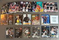 Photo showing 37 assorted Skybox basketball cards laid out, featuring Shaquille O'Neal, Michael Jordan, Scottie Pippen, Alonzo Mourning, David Robinson and other stars, some in protective sleeves.