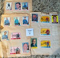 Scrapbook page showing hockey cards mostly of Pittsburgh Penguins players in light blue jerseys, with Canadiens and Seals cards also visible.