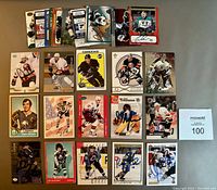 Top view of 25 autographed NHL hockey cards laid out showing signatures. Includes names like Pat Lafontaine, Alexander Mogilny, Jari Kurri among others.