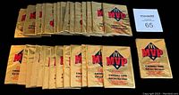 Top view of all 25 sealed 1993 Donruss McDonald's MVP baseball card packs arranged in rows, showing consistent gold foil packaging with red and blue logos.