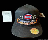 Front view of black Montreal Canadiens 1993 Stanley Cup Champions baseball hat with embroidered logo, hologram sticker on brim, and tag attached.