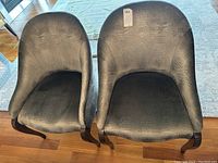 Pair of chairs front view showing matching upholstery and legs