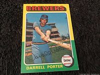 Front side of 1975 Darrell Porter Milwaukee Brewers baseball card showing player in batting pose with team colors and name.
