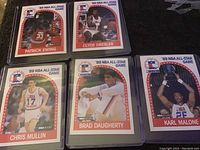 Five NBA Hoops '89 NBA All-Star Game player cards featuring Patrick Ewing, Clyde Drexler, Chris Mullin, Brad Daugherty, and Karl Malone.