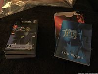 Stack of 60 Young Jedi collectible cards with visible character artwork and stats, folded rules booklet, and original packaging box.