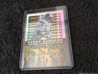Front view of the Barry Sanders Pinnacle Zenith 1995 collectible football card showing holographic design and player image.
