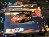 Front of collector's tin showing Jeff Gordon #24 car and image