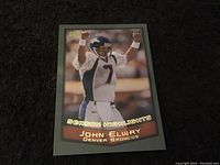 Front of John Elway football card showing celebratory image and text 'Season Highlights'