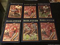 Seven Mark Rypien football cards arranged in two rows, showing different game action shots and poses, all with navy blue borders and 'Performance Highlights' branding.