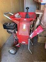 Front view of entire unit showing hopper, engine and wheels