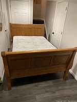 Amish double sleigh bed fully assembled with mattress on top