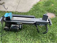 Full side view of horizontal splitter on grass